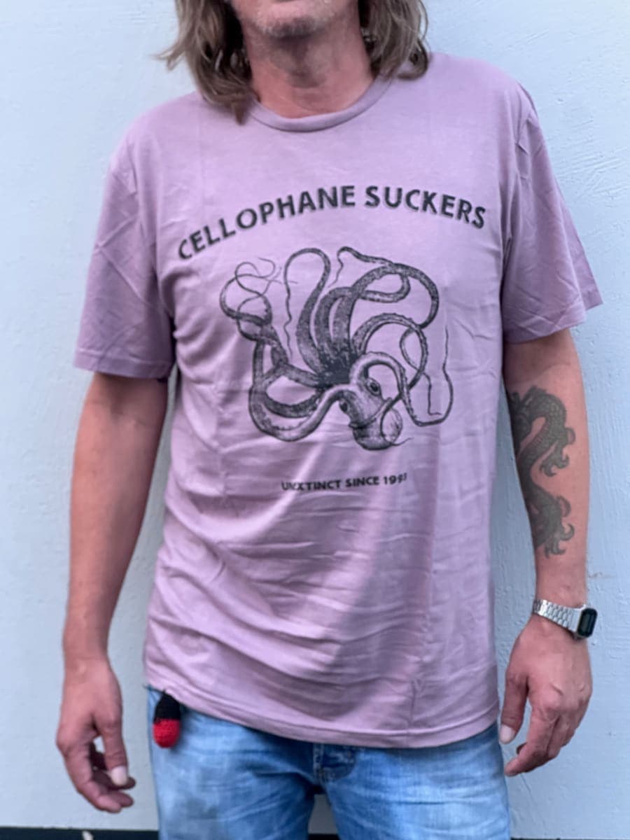 Lilac t-shirt with a black octopus print and the line Unextinct since 1993