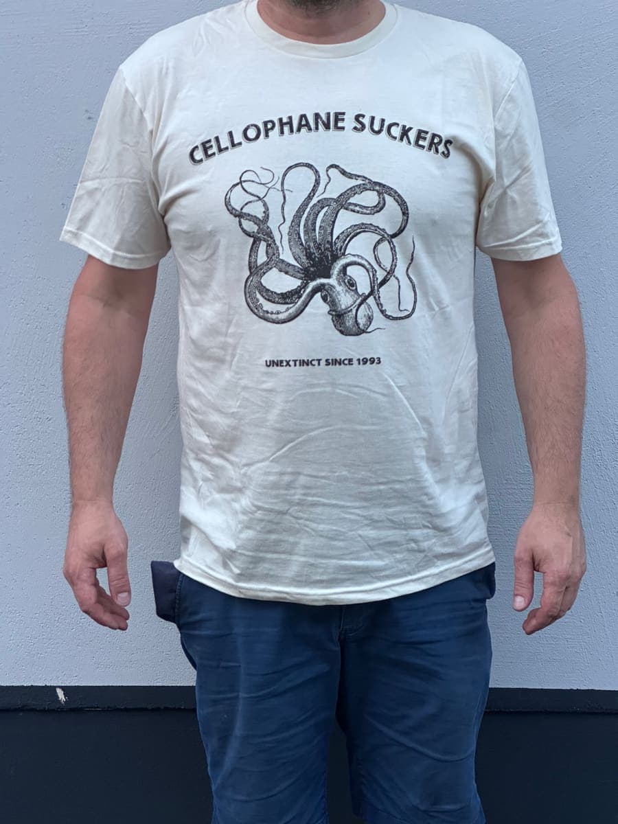 Natural white t-shirt with a black octopus print and the line Unextinct since 1993